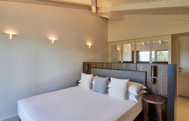 Baia di Chia Resort Sardinia_King Deluxe Room_Bedroom.jpg