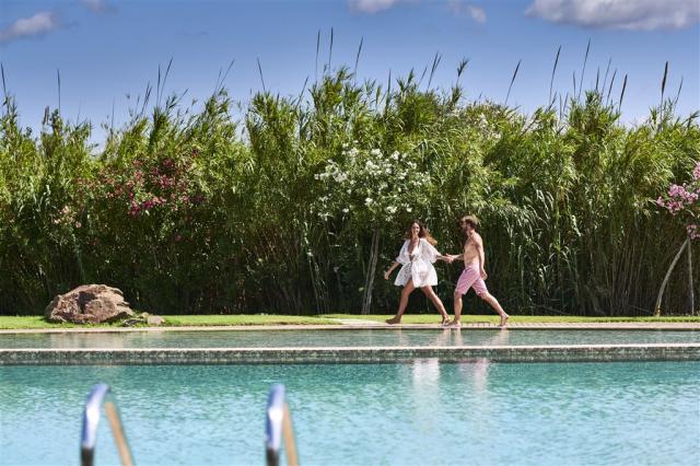 Baia di Chia Resort Sardinia_Pool Side Walking.jpg