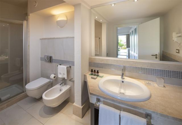 Chia Laguna-Hotel Village_Superior Room_Bathroom with shower.jp