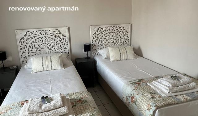 Niki-Apartments--přidat-popis-ronovovaný-(5).png